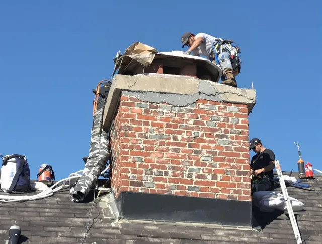 Brandon Chimney Sweep installing a custom chimney crown in Brandon, FL