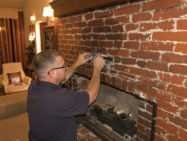 Brandon Chimney Sweep expert fixing a fireplace in Brandon, FL
